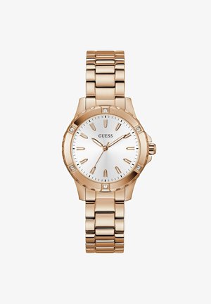 Montre en or rose avec un cadran argenté, des index horaires en chiffres romains et des accents en cristal. Elle dispose d'un bracelet en métal robuste.