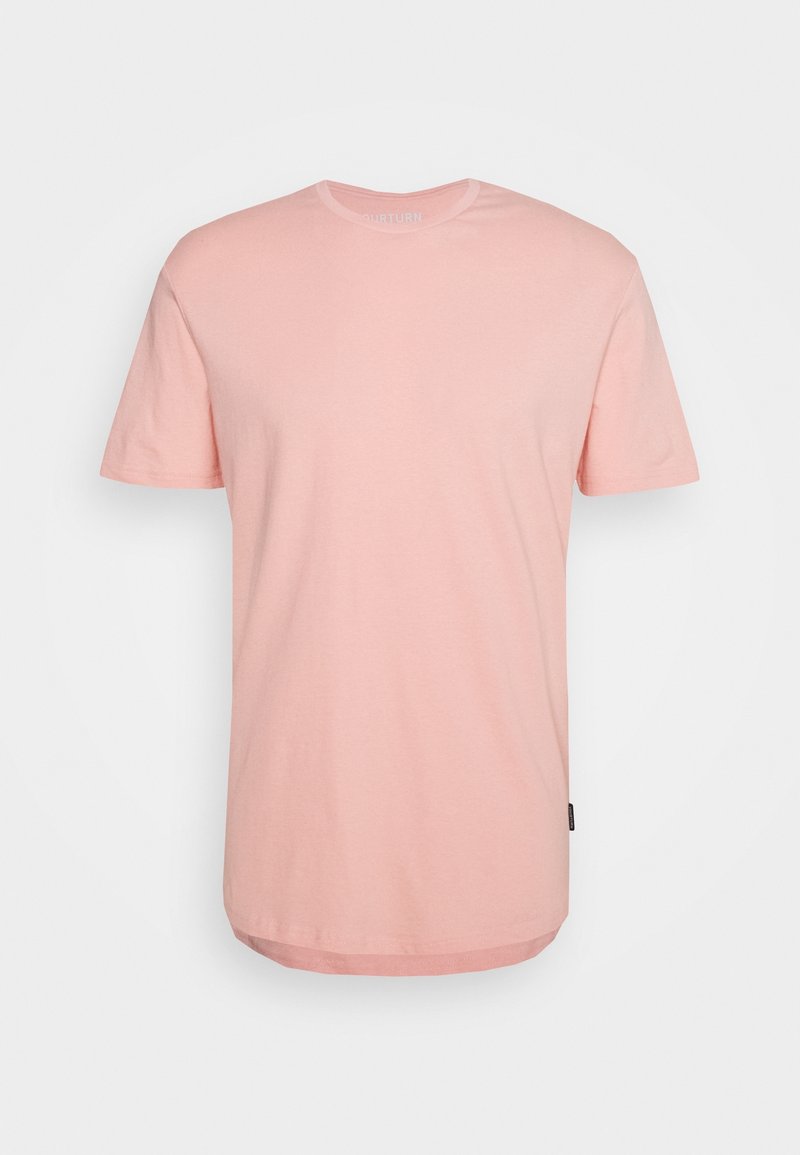 T-shirt uni rose clair à manches courtes avec col rond et ourlet droit, présenté sur fond blanc.