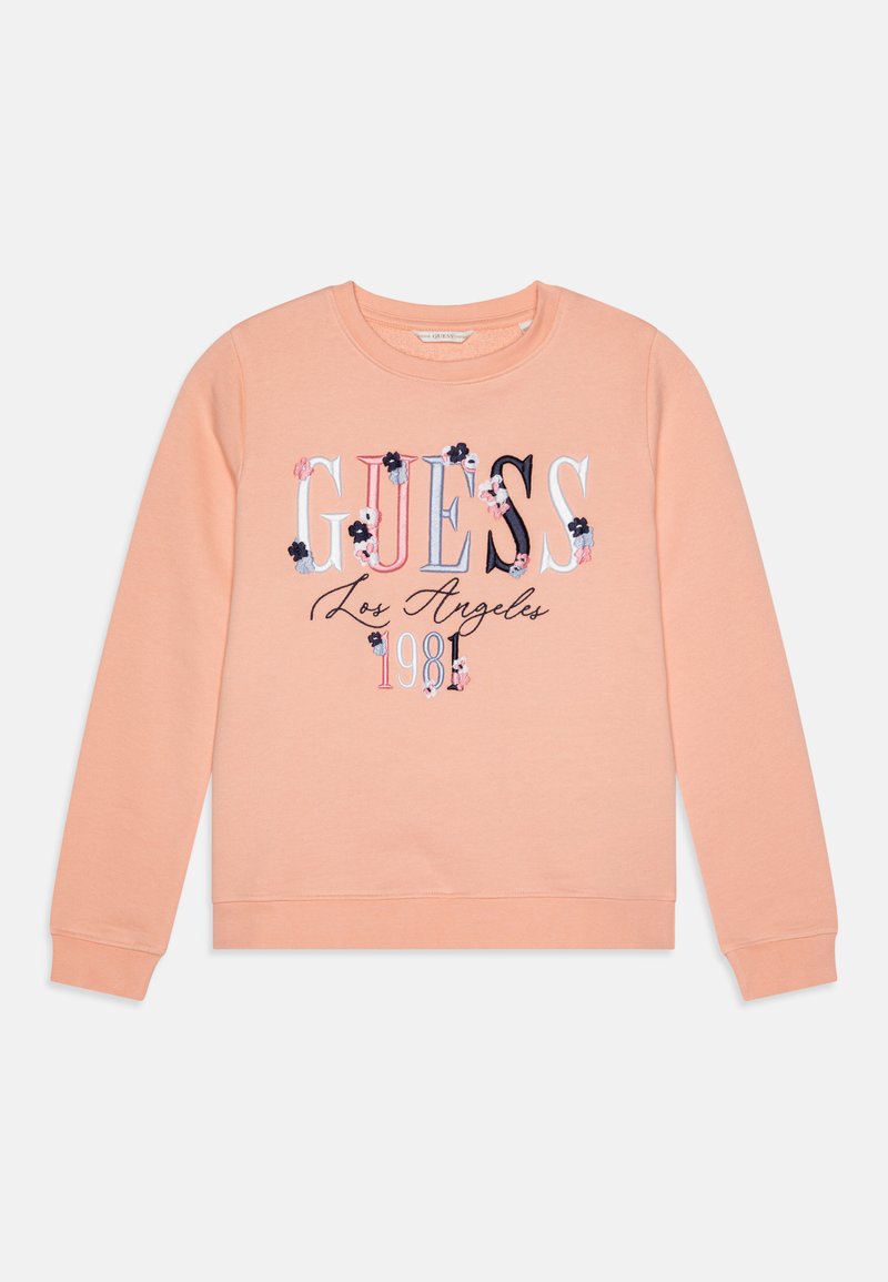 Perzikkleurig sweatshirt gemaakt van zachte stof, met geborduurd "GUESS" logo, bloemaccenten en een ronde halsontwerp.