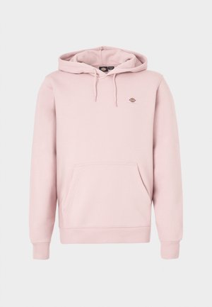 Lys rosa hettegenser med frontlomme, justerbar snor i hetten og en liten logo på brystet. Laget av mykt stoff med ribbestrikkede mansjetter.