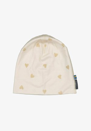 Kermamodulli, jossa on pieniä beige sydänkuvioita, pehmeää kangasta, pyöreä muoto ja sivulappu, jossa on sinisen ja keltaisen lipun kuvio.