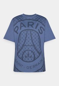 Blue cotton t-shirt featuring a textured graphic design with "PARIS" and "SAINT-GERMAIN" text, round neckline, and short sleeves.