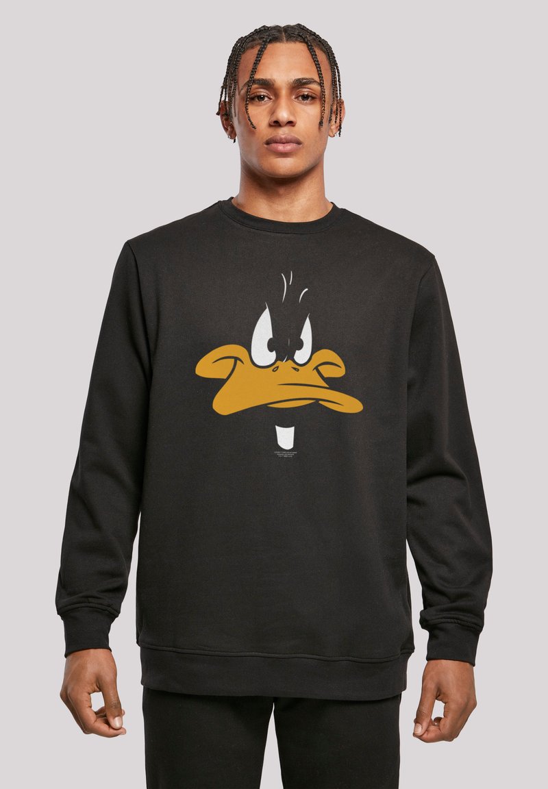 Felpa nera con una grande grafica di una faccia di anatra in un cartone animato, color arancione e bianco. Maniche lunghe con polsini e orlo a coste.