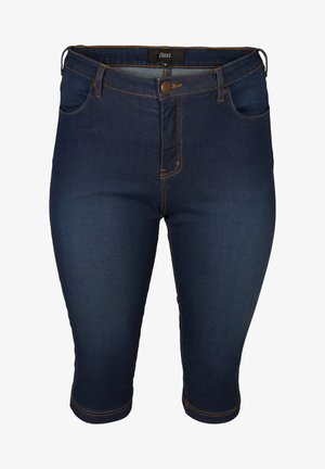 Jeansowe spodnie capri w ciemnoniebieskim kolorze z dopasowanym krojem, pięcioma kieszeniami i pomarańczowymi przeszyciami. Zapięcie na guzik w talii.