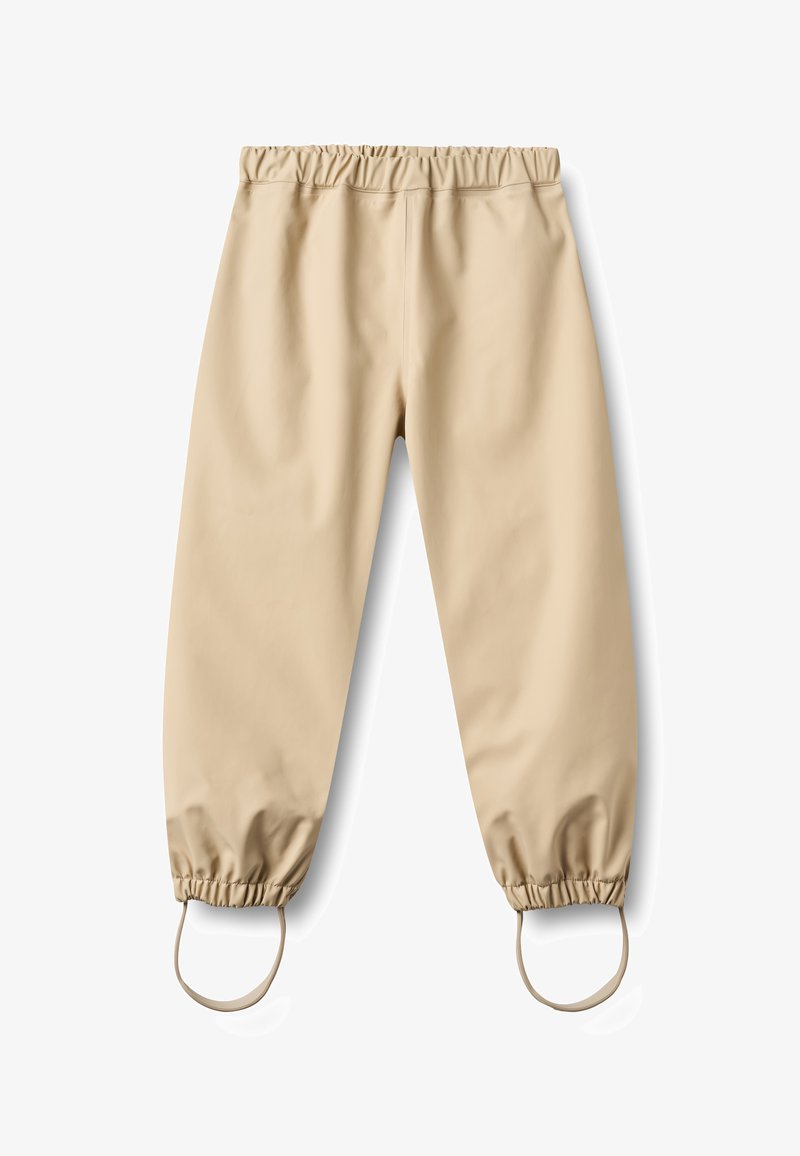 Pantalon imperméable beige avec taille élastique et bords de chevilles munis de sangles pour les pieds, conçu pour la protection en extérieur ou par temps de pluie.