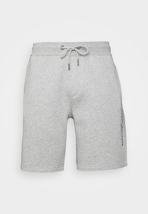 Pantalones cortos de mezcla de algodón en gris claro con cintura elástica, cordón ajustable, bolsillos laterales y un pequeño logo vertical en la pierna derecha.