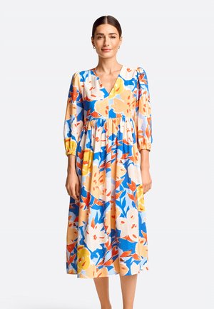 Blumenkleid im A-Linien-Schnitt mit blauen, gelben, orangefarbenen und roten Mustern. Lange Puffärmel und ein tiefer V-Ausschnitt aus leichtem Stoff.
