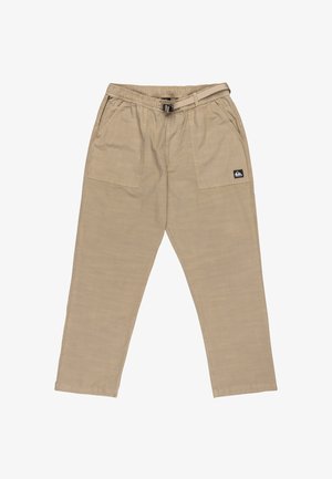 Beige Baumwollhosen mit elastischem Bund, Gürtelschlaufen und zwei Seitentaschen. Mit einem kleinen Markenlogo auf der linken Tasche.