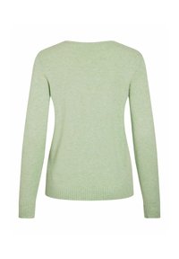 Pull vert clair à manches longues avec poignets et ourlet côtelés, vu de dos sur un fond blanc.