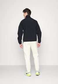 Jordan WARMUP - Casaco de verão - black