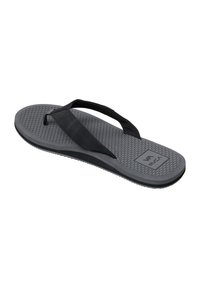 Gray flip-flop made of rubber, featuring a textured footbed and a black strap with a logo. Flat design and lightweight construction.
