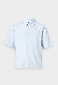 Short-sleeve, light blue button-up shirt with a textured, striped pattern and a left chest pocket. Fabric appears lightweight and breathable.