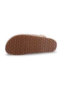 Semelle en caoutchouc marron avec un motif en nid d'abeille texturé, dotée d'un revêtement supérieur beige ressemblant à du suède pour une finition douce.