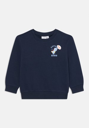 Námornícky modrý sveter s rebrovanými manžetami a lemom, s vyšitým grafickým motívom dinosaura a textom "LITTLE DINO" v bielej a farebných akcentoch.