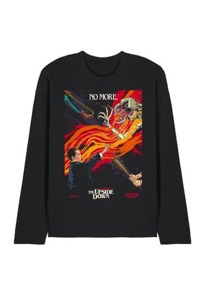 Black long-sleeve shirt with "Stranger Things" design showing a boy using powers against a creature, hands holding slingshot and bat nearby.