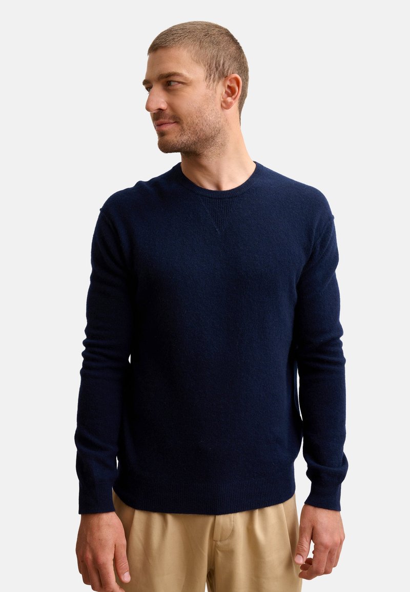 Maglione in maglia navy realizzato in tessuto morbido, con colletto rotondo e maniche lunghe, dal design pulito e con dettagli minimi.