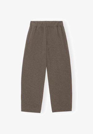 Pruunid, kergekaalulised, lõdvaltistuvate pükstega, millel on elastne vöökoht ja küljetaskud. Kangal on peen tekstuur ja sile viimistlus.