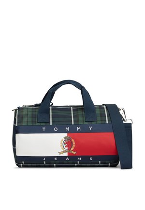 Μικρή τσάντα duffel με ναυτικό καρό σχέδιο, μπλε λαβές, μπλε ρυθμιζόμενο ιμάντα ώμου και οριζόντιο πάνελ με το λογότυπο Tommy Jeans σε κόκκινο, λευκό και μπλε.