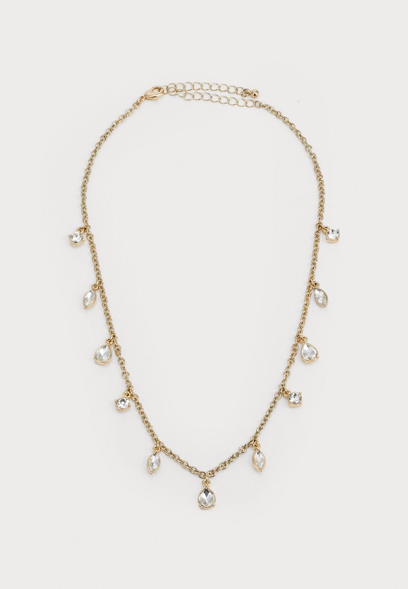 Gold chain necklace with alternating clear teardrop and round crystal charms on a white background.