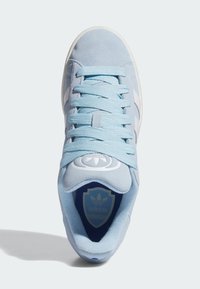Light blue suede sneaker with white stripes and laces, rounded toe, padded collar, and blue insole featuring the Adidas logo.