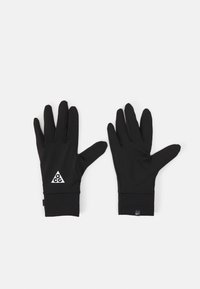 Black gloves made of a smooth, stretchy material. They feature a triangular white logo and snug cuffs for comfort and ease of wear.
