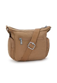 Borsa a tracolla in nylon marrone con tracolla regolabile, chiusura con zip, tasca anteriore e dettagli con zip laterale. Compatta e con una texture morbida.