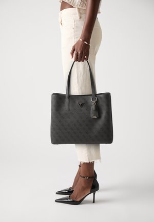 Gray leather tote bag with textured finish, dual handles, triangle logo, and detachable keychain. Features a zip closure and spacious design.