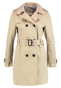 Beige trench coat with double-breasted button closure, adjustable belt, shoulder epaulets, and a striped inner lining. Smooth fabric texture.