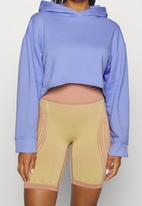 Nike Performance Jersey con capucha - lilac