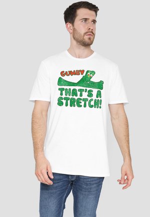 Weißes Baumwoll-T-Shirt mit einem grafischen Druck von Gumby in Grün und rotem Text "GUMBY, DAS IST EINE DEHNUMG!" auf der Vorderseite.