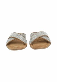 Light brown slide sandals with crisscross straps adorned in silver rhinestones, flat sole, and smooth texture.