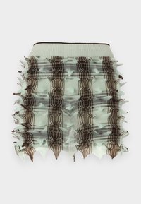 Mintozaļa volāna svārku ar būra dizainu, kas rotāta ar brūniem rūtainiem rakstiem un adatainām malām. Elastīga josta nodrošina labu piegulšanu.