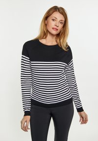 Schwarz-weißer gestreifter Pullover mit Rundhalsausschnitt und gerippten Bündchen. Glatte Textur, enganliegendes Design und lange Ärmel.