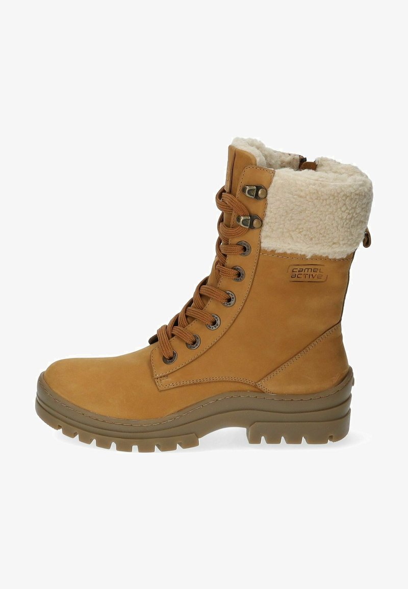 Tan waterproof lace-up boots with faux fur lining, metal eyelets, and a rugged rubber sole. Features prominent stitching and logo detail.