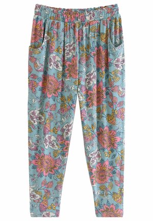 Loszittende broek met elastische taille en zijzakken, met een blauwe achtergrond en een groot roze, wit en geel bloemmotief.