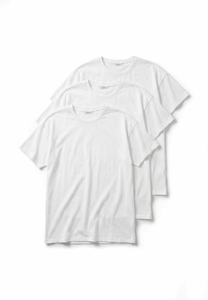 Three plain white short-sleeve crew neck t-shirts stacked diagonally on a white background.