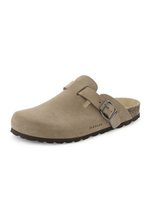Beige suede slip-on clog with adjustable metal buckle, contoured cork footbed, and black textured sole for casual wear.
