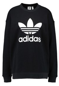 Svart sweatshirt i bomull med en vit Adidas-logotyp och tre ränder på framsidan. Rund halsringning med ribbstickade muddar och fåll.