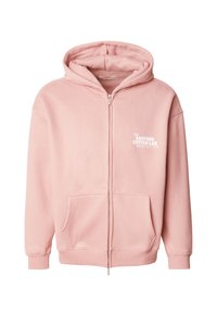 Rosa Kapuzenpullover mit Reißverschluss aus Baumwolle, mit einer Fronttasche und einer Kapuze. Er trägt weißen Text mit der Aufschrift "THE ANOTHER COTTON LAB BREAKFAST CLUB".