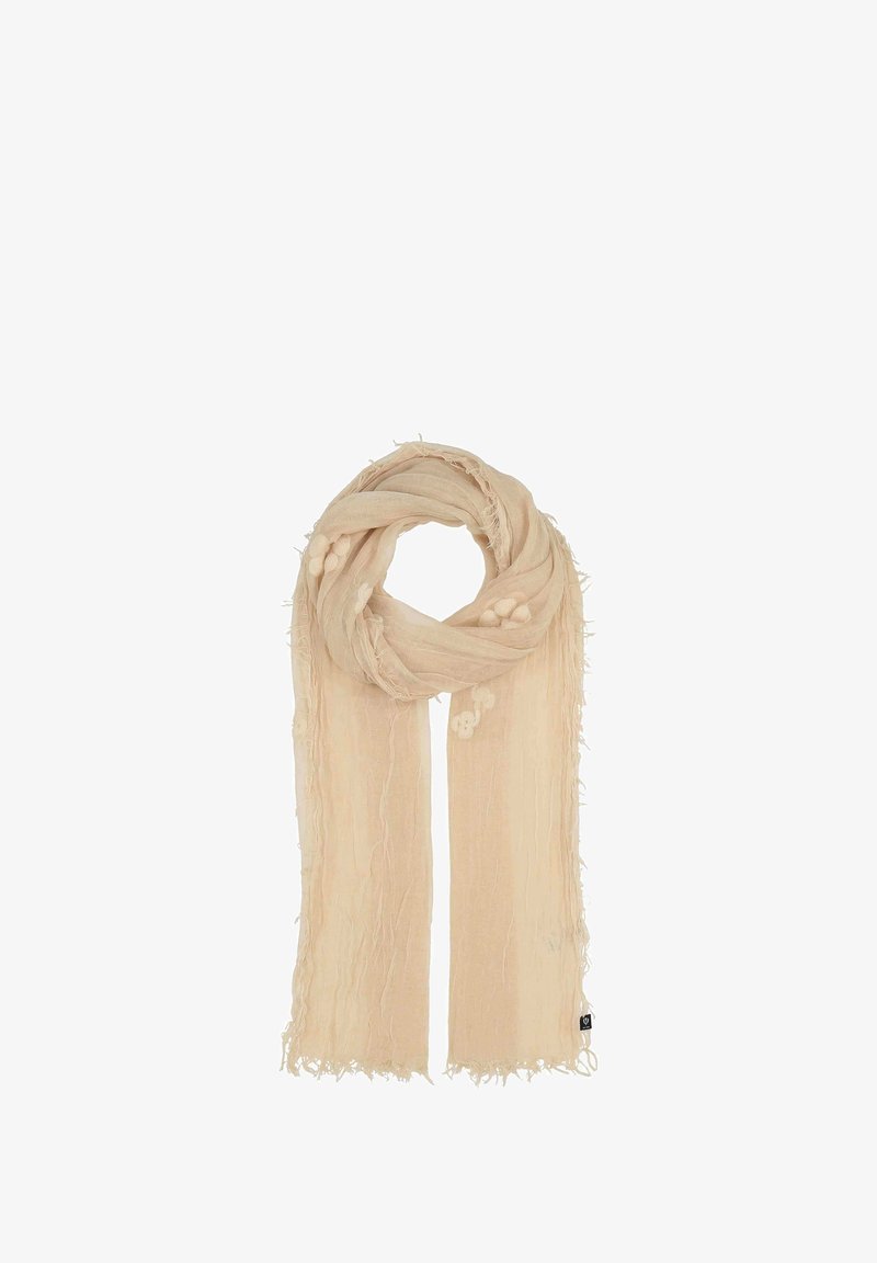 Écharpe beige clair avec une texture froissée. Les extrémités présentent des bords effilochés, et il y a des motifs brodés subtils le long du tissu.