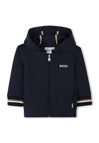 Marinefarbener Zip-Hoodie aus weichem Stoff mit weißen und gestreiften Bündchen. Verfügt über eine Kängurutasche und ein kleines gesticktes Logo auf der Brust.
