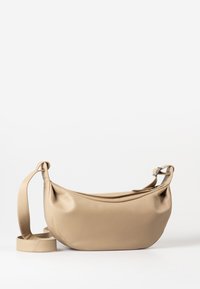 Beige leather shoulder bag with a smooth texture, rounded shape, adjustable strap, and soft fold details on the front.