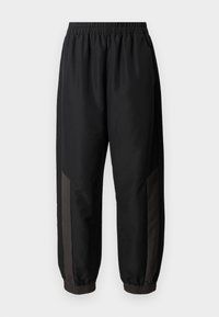 Schwarze Sporthose aus glattem, leichtem Stoff. Mit elastischem Bund, enganliegenden Bündchen und dunkelgrauen seitlichen Einsätzen mit Logo.
