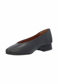 Zapato formal plano negro con punta redonda, tacón bajo cuadrado, parte superior de cuero liso y un diseño simple y limpio. El interior tiene un forro marrón claro.
