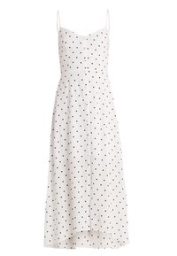 Bílá bezramínková šaty s černými puntíky, s knoflíkovým zapínáním vpředu a splývavým lemem. Vyrobeno z lehkého materiálu s hladkou texturou.