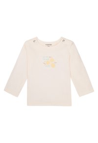 Cremfarbendes Langarmshirt mit Druckknöpfen an der Schulter. Verziert mit zwei gelben Obstgrafiken und hellblauem Text: "Du bist der Apfel meines Auges."