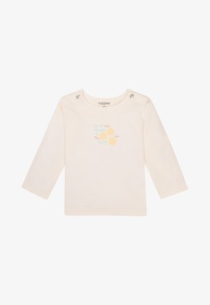 Crème kleurig shirt met lange mouwen en drukknopen op de schouders. Bevat twee gele fruitafbeeldingen en lichtblauwe tekst: "je bent de appel van mijn oog."
