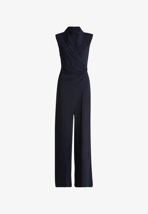 Salopette sans manches bleu marine avec un design drapé enveloppant, dotée d'un tissu texturé et d'un fermoir sécurisé à la taille pour une silhouette ajustée.