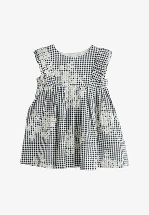 Schwarz-weiß kariertes Gingham-Kleid mit gerüschten Ärmeln, weißer Blumenstickerei und einem gerafften Taillenbereich. Hergestellt aus leichtem Stoff.