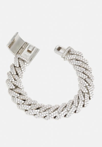 Silver bracelet featuring a braided design adorned with multiple small clear crystals, secured with a metallic clasp.